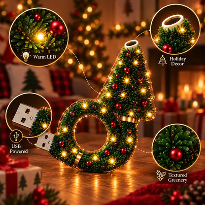 Close-up of warm LED lights, textured greenery and USB plug of the Christmas Cozy Lamp